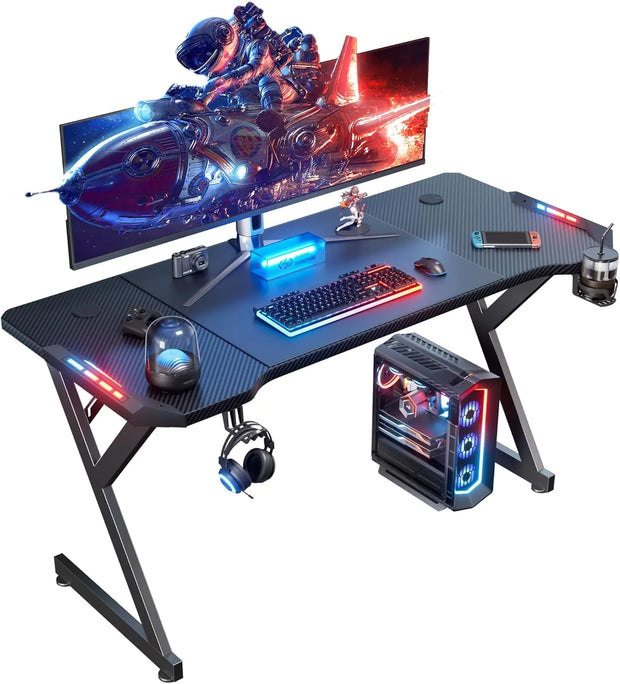 HLDIRECT 55 Inch Gaming Desk with LED Lights Ergonomic Computer Gaming Table with Carbon Fibre Surface Sturdy PC Workstation Desk for Gaming and Home Office with Headphone Hook Cup Holder Black